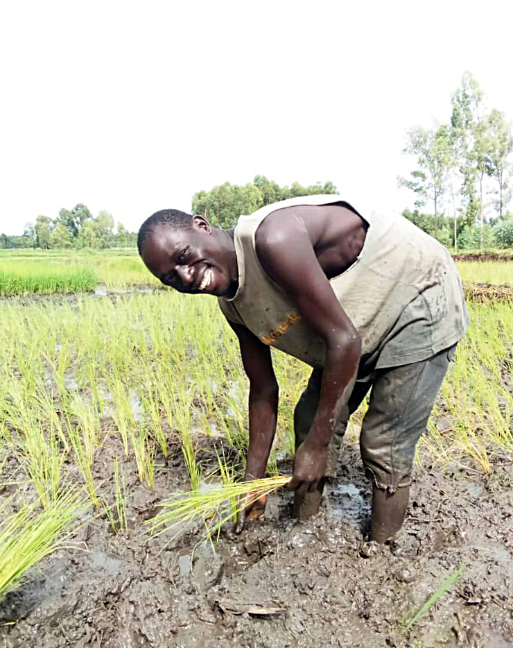 Denis in rice field.jpeg